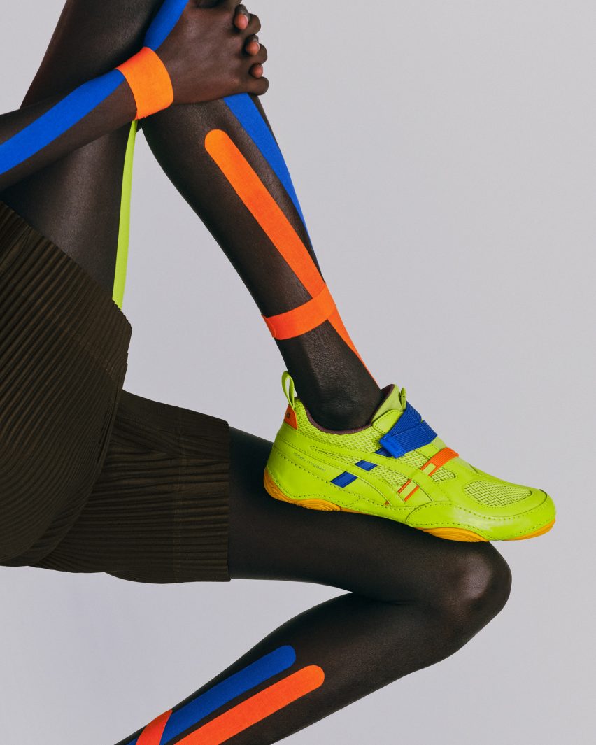 Person wearing bright green sneakers