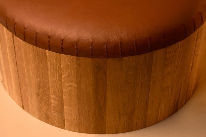 Stitching on bench with leather upholstery