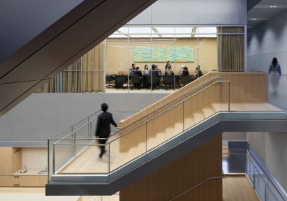 A staircases rising through an atrium, providing access to a boadroom