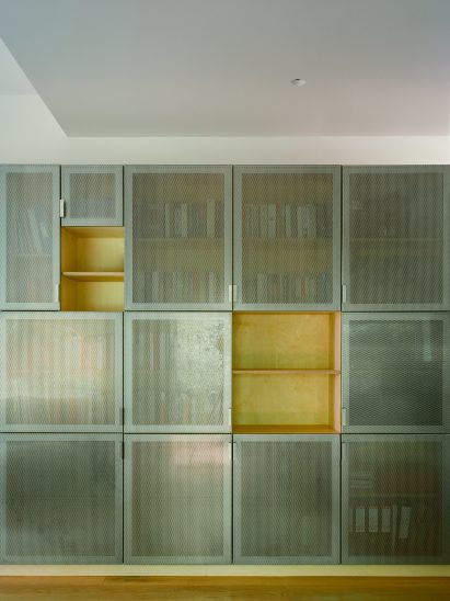 Perforated steel front of home extension by Neiheiser Argyros