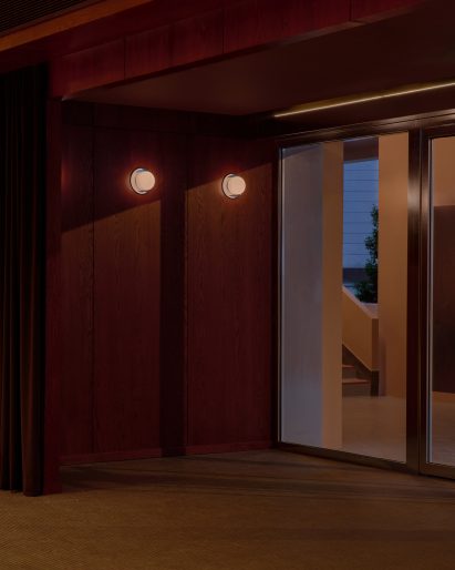 Teak panels next to glass door at New Bahru Hall