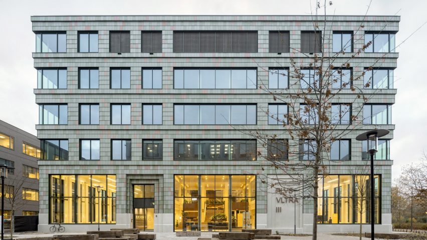 Building clad in plastic tiles