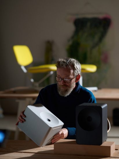 Erwan Bouroullec holding a speaker