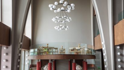 Community hall with sculptural lamps