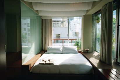 Bedroom of hotel designed by Kiyoaki Takeda Architects and Staple Studio