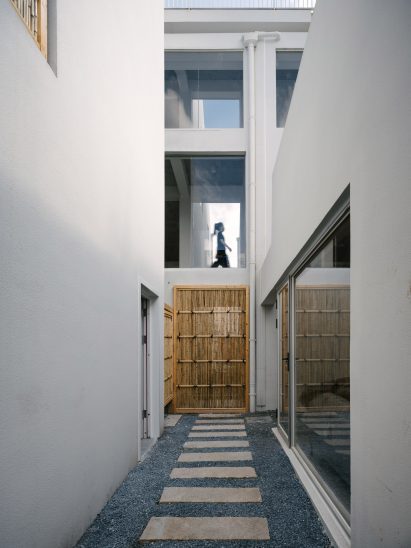 Paving stones leading through courtyard outside guesthouse
