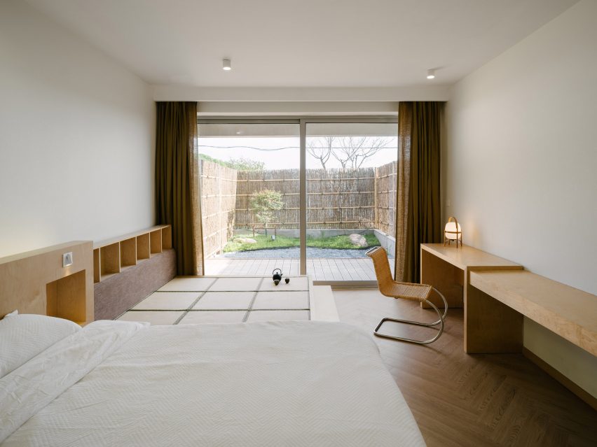 Guest bedroom with private outdoor space beyond