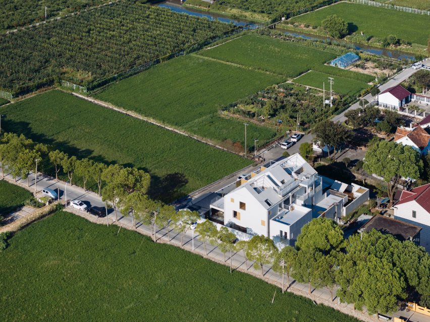 White guesthouse overlooking rice fields China