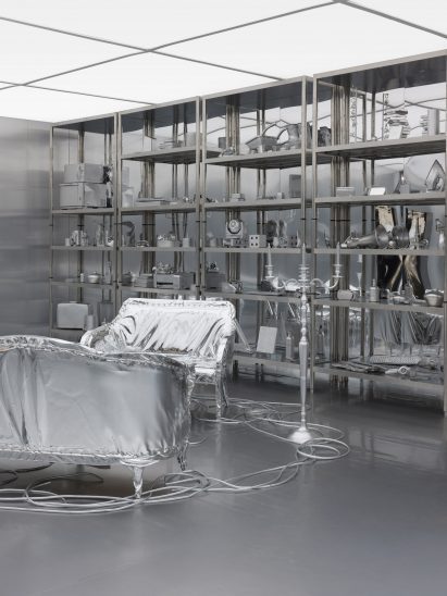 Silver sofas and shelves in a silver room