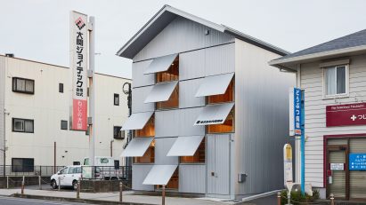 Office with steel-shutter facade