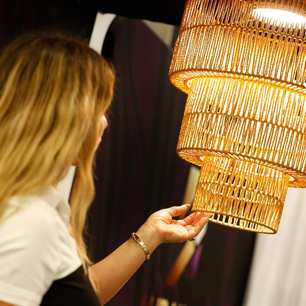 Photo of person looking at a lamp