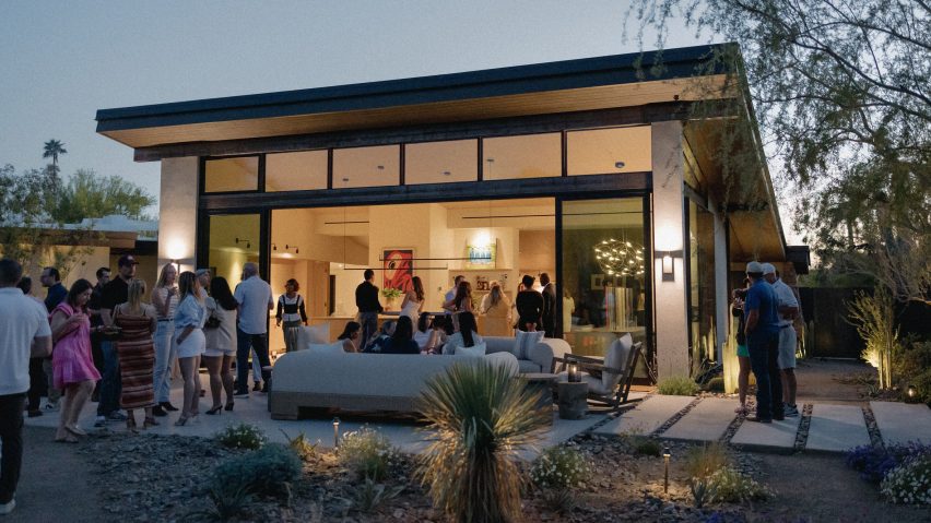 Photo of people stood in the garden of a house