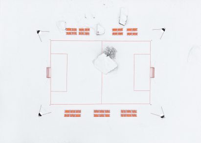 Orange football pitch in snowy landscape