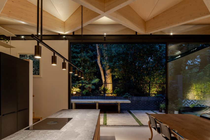 Kitchen with exposed timber diagrid roof in Arbour House by Andrei Saltykov