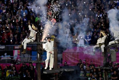 Bad Bunny scaling sparking power lines during his halftime show