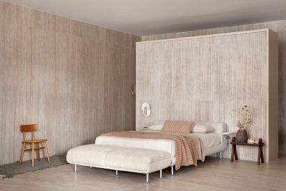 A bedroom hosting sculptural works by Lucas Simões