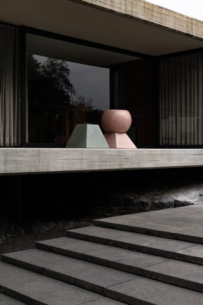 Sculptural furniture on modernist house plinth