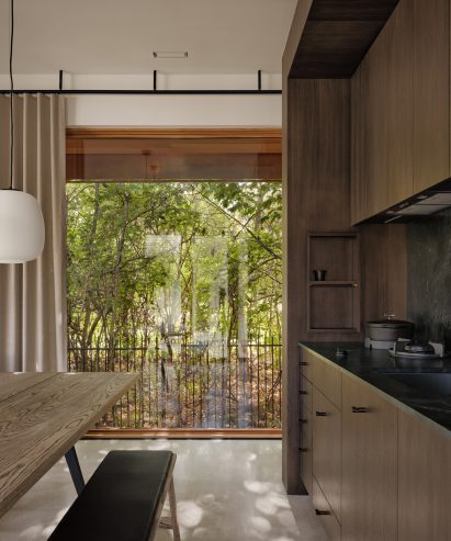 Neutral-toned kitchen overlooking a garden