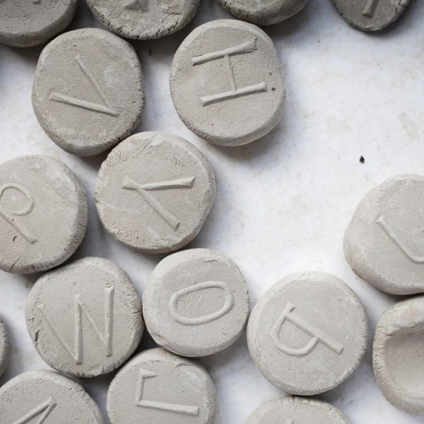 grey circles with letters on them