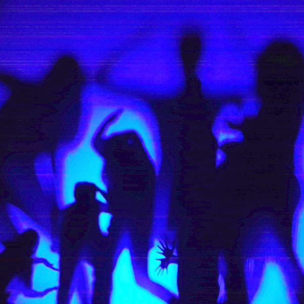 silhouettes of people against a blue backdrop