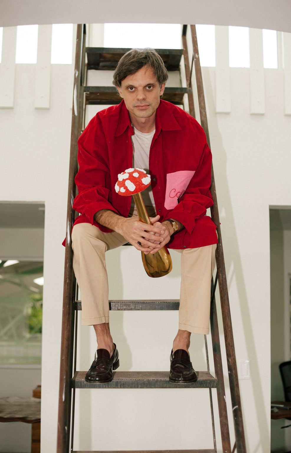 Nikolai Haas holding mushroom bottle