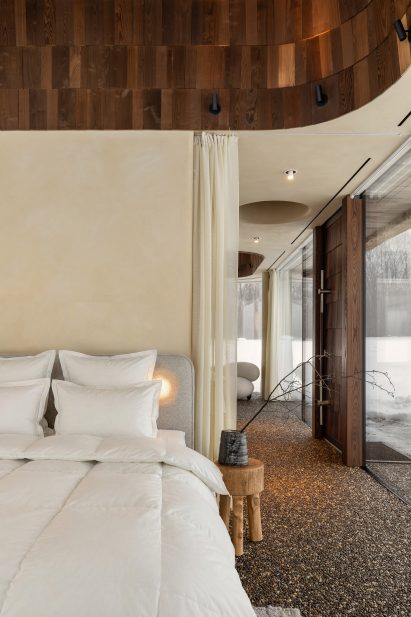 Neutral interior inside glass-walled hut
