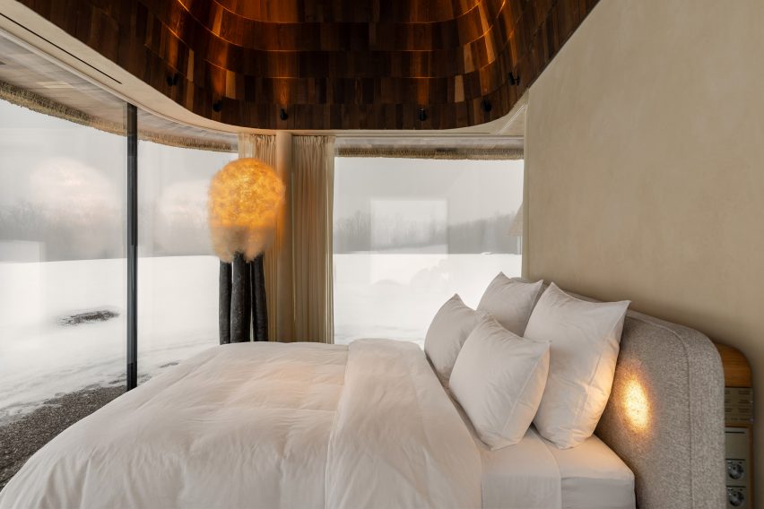 Neutral interior inside glass-walled hut