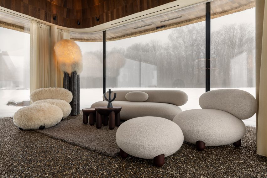 Neutral interior inside glass-walled hut