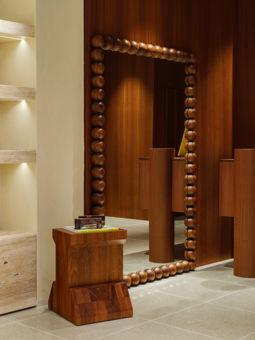 Wooden walls and sculptural mirror