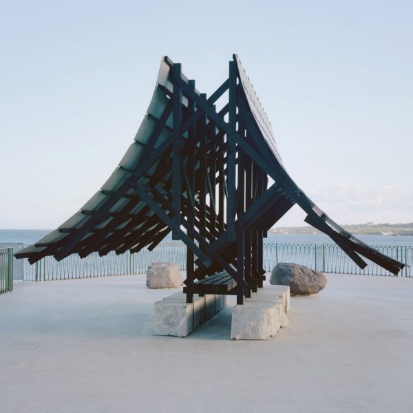 Asympta pavilion with wood roof