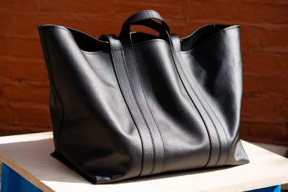 Photo of a large black tote bag by BEEN London in a soft and supple black material that looks like leather but is actually New Grain by Arda