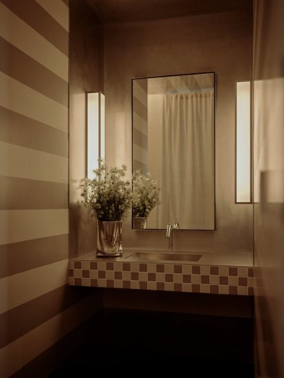 Bathroom featuring striped walls and ceilings influenced by Mario Botta