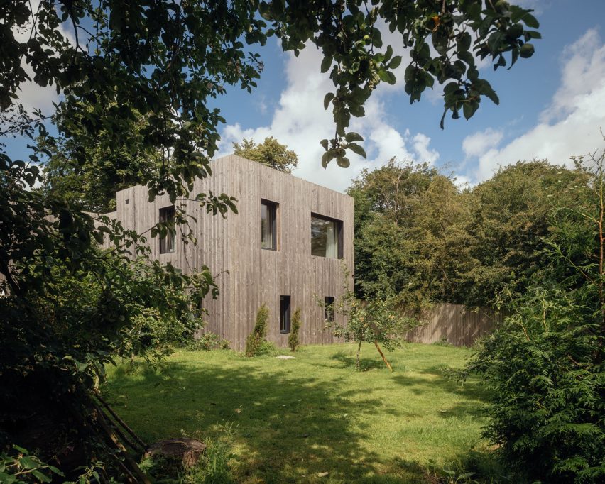 Larch-clad exterior of Orchard House designed by Studio Bark
