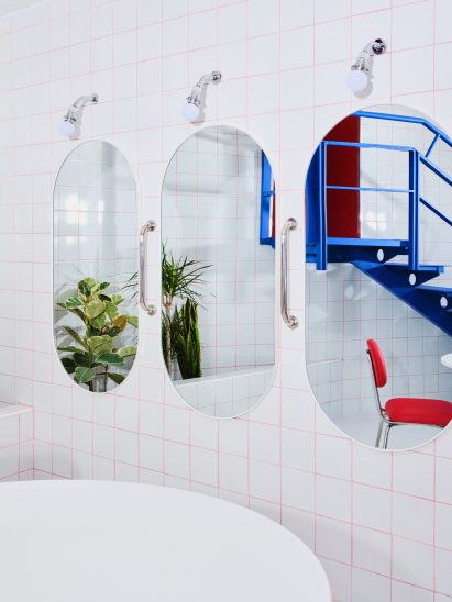 Mirrors in front of tiled wall