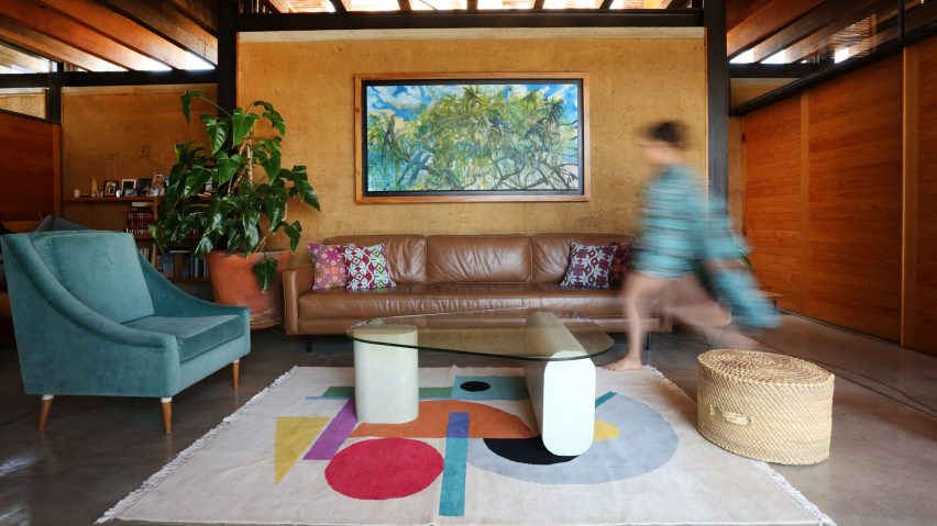 Photo of person walking through a living room