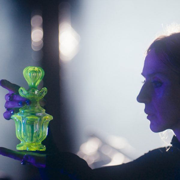 Woman holding crystal bottle