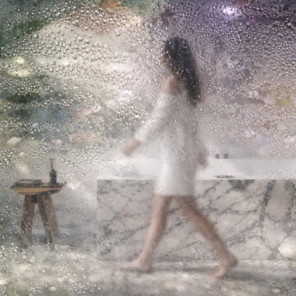 Distorted image of person in a bathroom