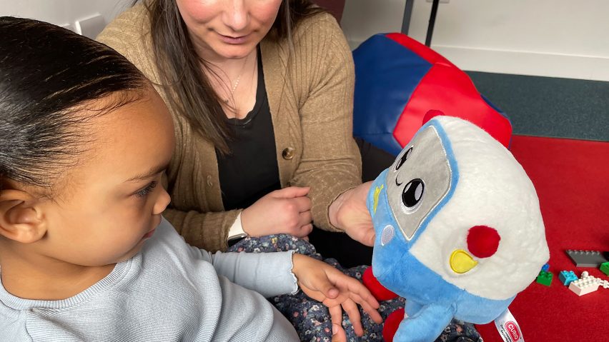 A mother and child play with a cuddly soft toy for the AI in the Early Years study at the University of Cambridge