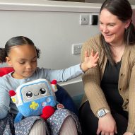 A mother and child play with a cuddly soft toy for the AI in the Early Years study at the University of Cambridge