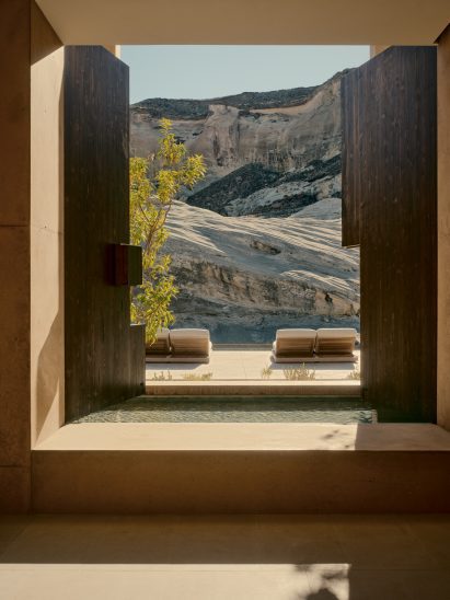 Wooden shutters swung open to allow light into an entry vestibule