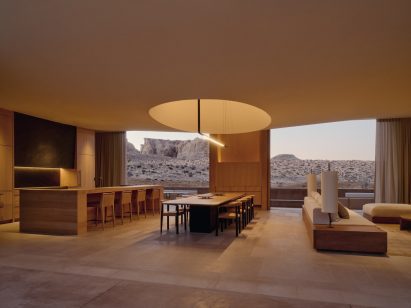 Living, dining and kitchen area with a large oculus above the table