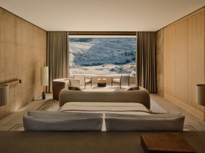 Bedroom with desert landscape outside the window