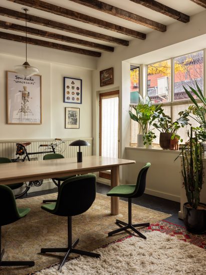 Office with exposed wooden ceiling beams and picture rails