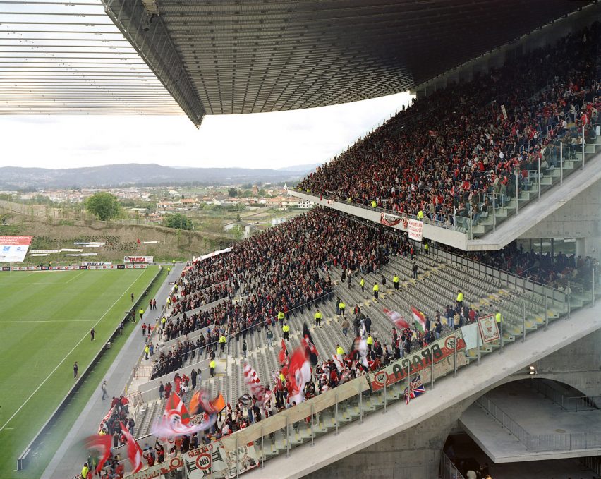 Crowds filling a concrete stand beneath a cable-suspended roof at Braga Municipal Stadium