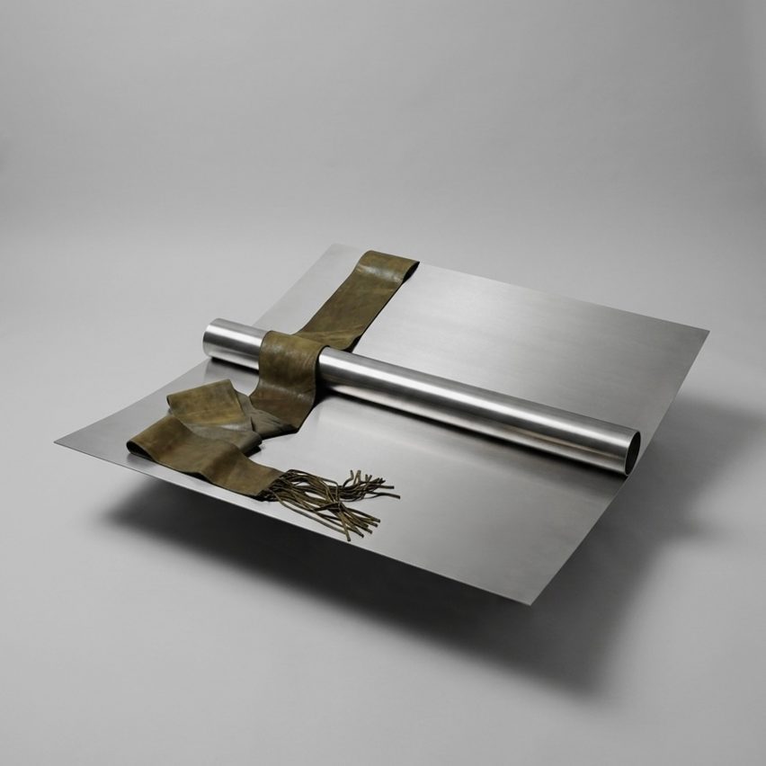 Metal daybed with scarf on it
