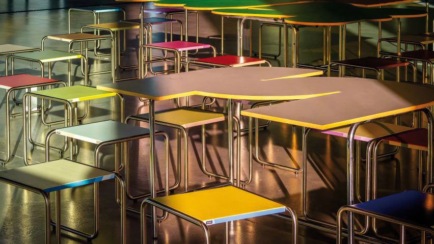 a photograph of a group of tables in a classroom