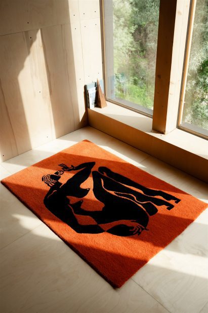 Orange rug with illustrative pattern