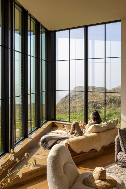 Corner window of a home overlooking the coast