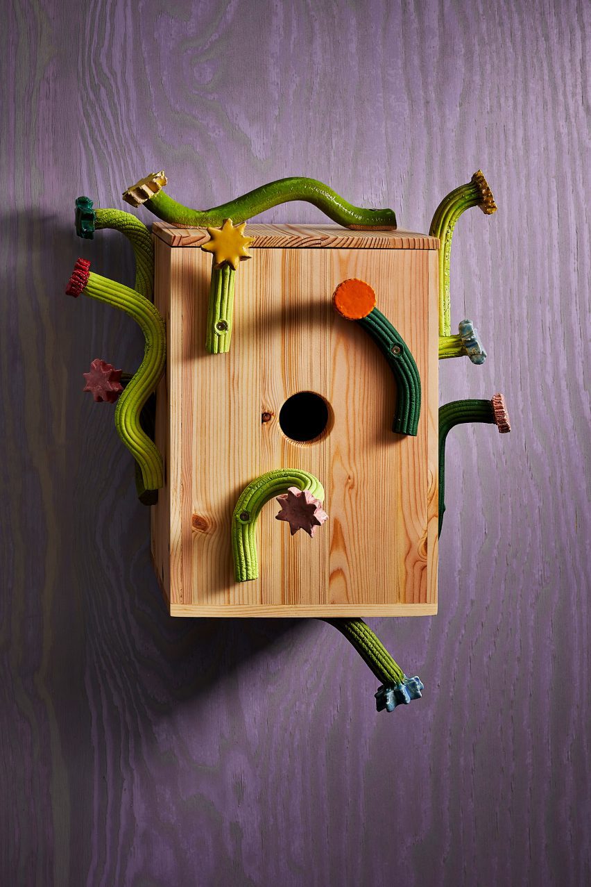 Birdhouse with green vines