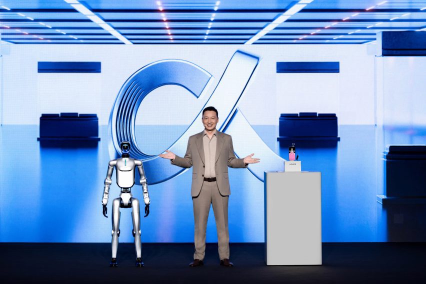 Photo of the Honor CEO on stage with a humanoid robot and the Robot Phone at Mobile World Congress 2026